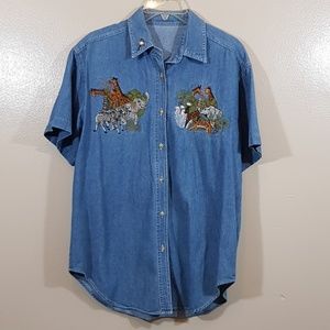 Denim shirt with animals fits like a women medium